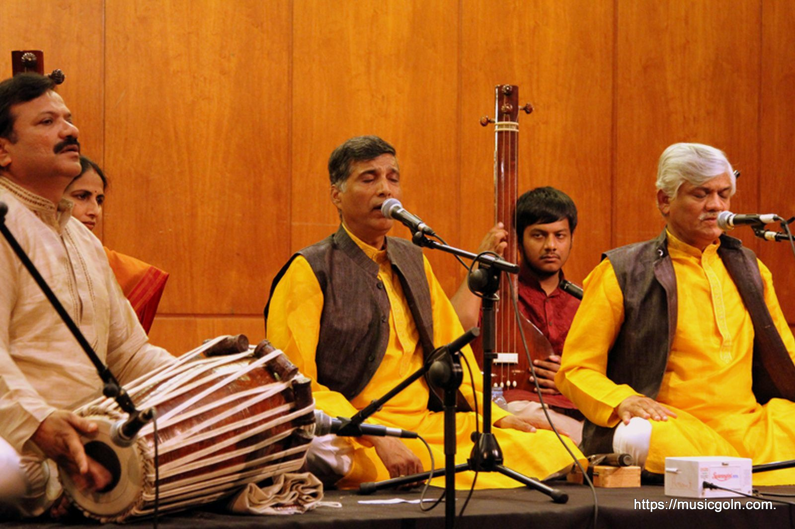 a group of men playing a musical instrument
